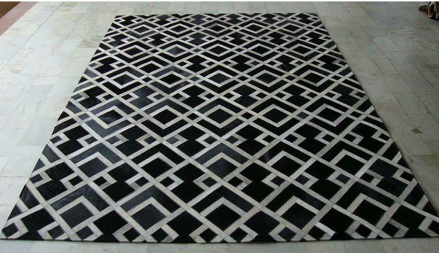 Geometrischer Rauten-Patchwork-Lederteppich in Schwarz-Weiß